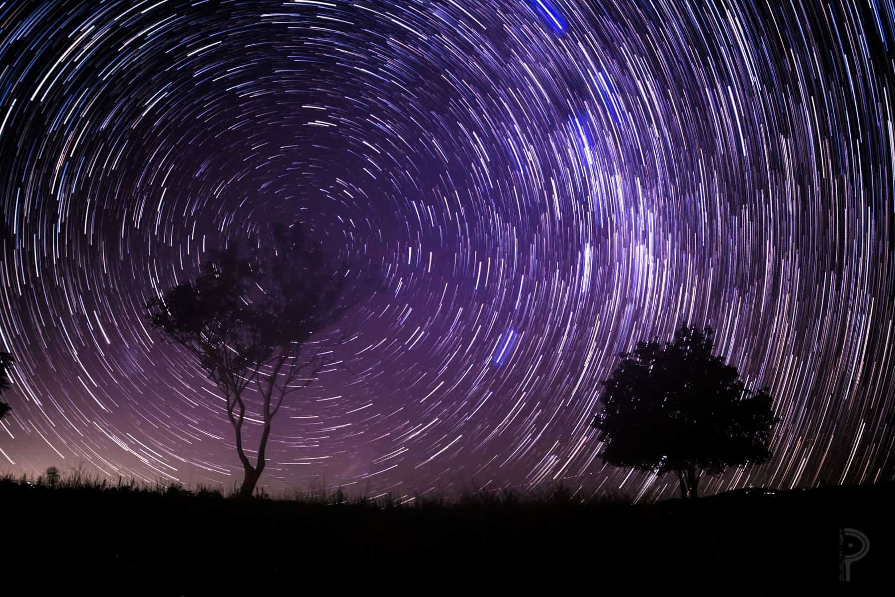 The Milky Way above a dark landscape at night